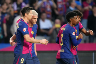 Dani Olmo celebrates with Barcelona teammates