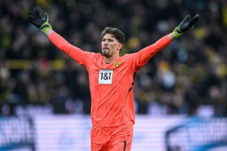 Gregor Kobel raises arms (Photo by Frederic Scheidemann/Getty Images)