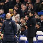 Enzo Maresca, Manager of Chelsea, reacts alongside Mikel Arteta, Manager of Arsenal.