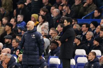Enzo Maresca, Manager of Chelsea, reacts alongside Mikel Arteta, Manager of Arsenal.