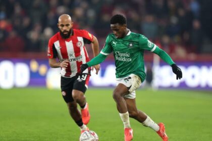 Bali Mumba of Plymouth Argyle runs with the ball