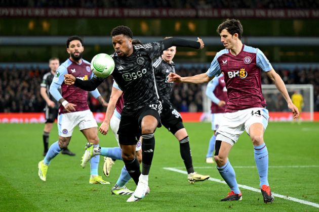 Chuba Akpom of Ajax battles for possession with Pau Torres of Aston Villa.