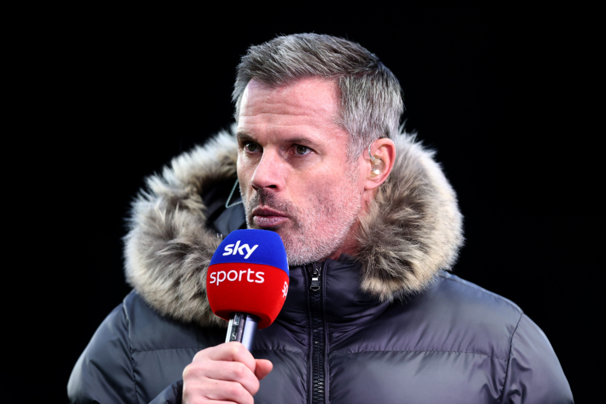 Jamie Carragher talks on a Sky Sports mic