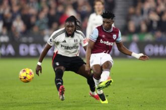 Mo Kudus of West Ham United passes the ball