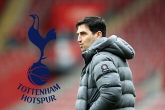 Andoni Iraola looks on - with Spurs badge attatched
