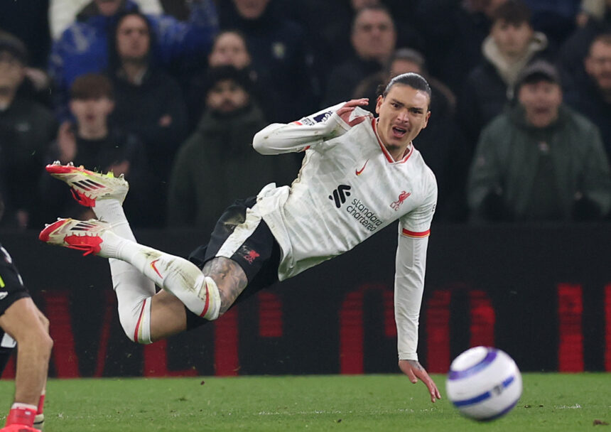 Darwin Nunez of Liverpool is hit by Emiliano Martinez of Villa