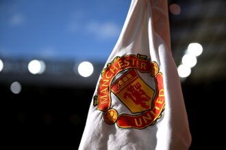 MANCHESTER, ENGLAND - AUGUST 16: A detailed view of a corner flag prior to the Premier League match between Manchester United FC and Fulham FC at Old Trafford on August 16, 2024 in Manchester, England.