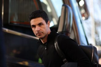Arsenal manager Mikel Arteta steps off the team bus