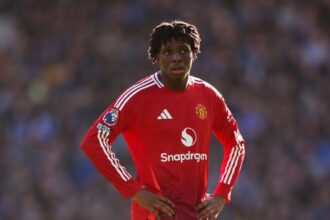 Patrick Dorgu of Manchester United looks on during the Premier League match between Everton FC and Manchester United FC