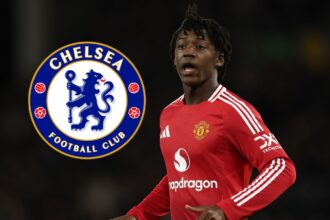 Kobbie Mainoo looks on - with the Chelsea badge attached