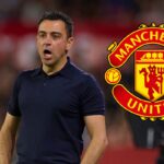 Xavi shouts from the touchline - with the Man United badge attached