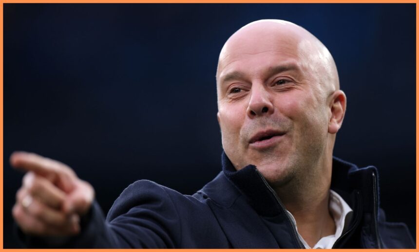 Liverpool head coach Arne Slot points at something at the Etihad Stadium.