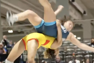 Watch Olympic silver medalist Kennedy Blades hit signature suplex, launching opponent into air
