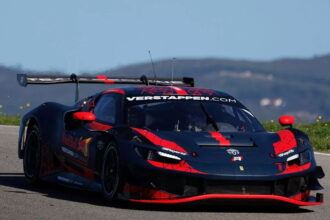 Max Verstappen is behind the wheel... of a Ferrari