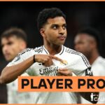 Rodrygo Goes celebrates by pointing to the Real Madrid badge on his shirt