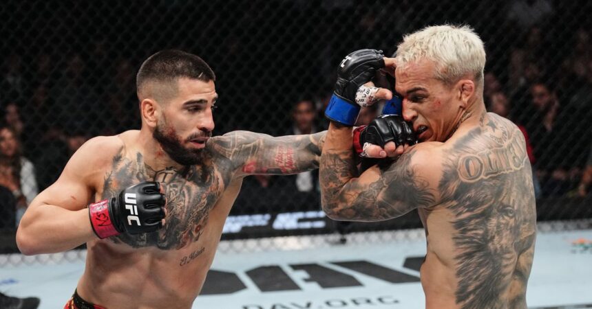Ilia Topuria sleeps Charles Oliveira with brutal knockout, nearly brawls with Paddy Pimblett after UFC 317 main event