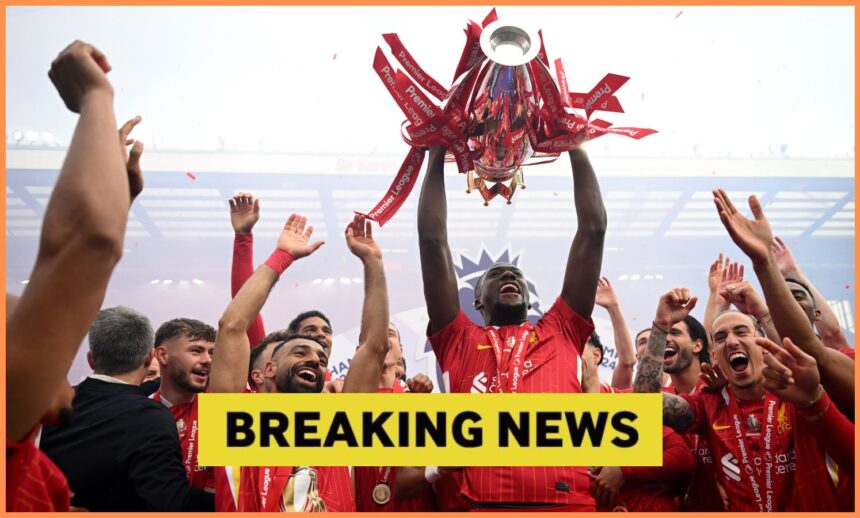 Ibrahima Konate lifts the Premier League trophy with Liverpool