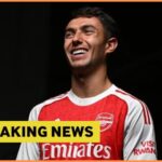 Martin Zubimendi poses in his Arsenal kit, plus breaking news banner