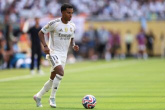 Rodrygo #11 of Real Madrid C.F. controls the ball