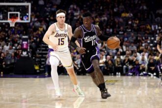 Dennis Schröder #17 of the Sacramento Kings is guarded by Austin Reaves #15 of the Los Angeles Lakers during the first quarter at Golden 1 Center on October 26, 2025 in Sacramento, California.