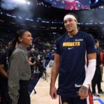 Aaron Gordon speaks on sidelines to Malika Andrews