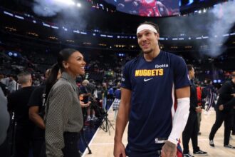 Aaron Gordon speaks on sidelines to Malika Andrews