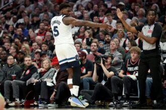 Minnesota Timberwolves guard Anthony Edwards celebrates after making a three-pointer.