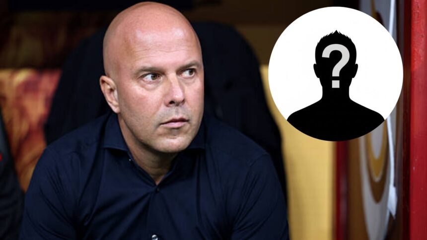 Arne Slot sits down in the dugout during Liverpool