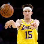 Austin Reaves #15 of the Los Angeles Lakers controls the ball during play against the Minnesota Timberwolves at Crypto.com.