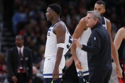 Minnesota Timberwolves head coach Chris Finch and Minnesota Timberwolves guard Anthony Edwards (5) during the second half against the Chicago Bulls on November 7, 2024 at the United Center in Chicago, Illinois.