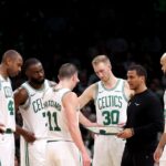 Boston Celtics head coach Joe Mazzulla stands in a huddle with Al Horford #42, Jaylen Brown #7, Payton Pritchard #11, Sam Hauser #30 and Derrick White #9 during the second half of the game against the Portland Trail Blazers at TD Garden on March 05, 2025 in Boston, Massachusetts.