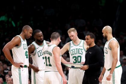Boston Celtics head coach Joe Mazzulla stands in a huddle with Al Horford #42, Jaylen Brown #7, Payton Pritchard #11, Sam Hauser #30 and Derrick White #9 during the second half of the game against the Portland Trail Blazers at TD Garden on March 05, 2025 in Boston, Massachusetts.