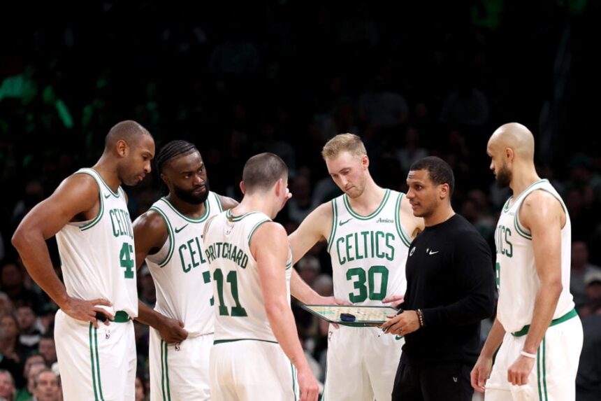 Boston Celtics head coach Joe Mazzulla stands in a huddle with Al Horford #42, Jaylen Brown #7, Payton Pritchard #11, Sam Hauser #30 and Derrick White #9 during the second half of the game against the Portland Trail Blazers at TD Garden on March 05, 2025 in Boston, Massachusetts.
