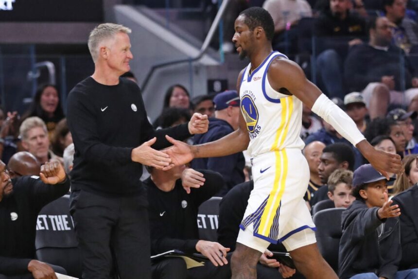 Golden State Warriors' head coach Steve Kerr slaps hands with Jonathan Kuminga in 2nd quarter of Dubs' 111-103 win over Los Angeles Lakers during a preseason NBA game at Chase Center in San Francisco on Sunday, October 5, 2025.