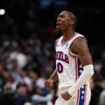Tyrese Maxey #0 of the Philadelphia 76ers celebrates after a play against the Washington Wizards during overtime at Capital One Arena.