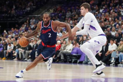 Kawhi Leonard #2 of the Los Angeles Clippers dribbles the ball around Walker Kessler #24 of the Utah Jazz during the first half of their game at the Delta Center on October 22, 2025 in Salt Lake City, Utah.