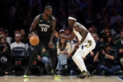 Julius Randle #30 of the Minnesota Timberwolves dribbles the ball against Pascal Siakam #43 of the Indiana Pacers.