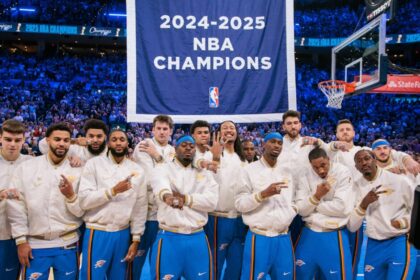Oklahoma City Thunder players pose with their rings in front of the championship banner prior to the game against the Houston Rockets at Paycom Center.