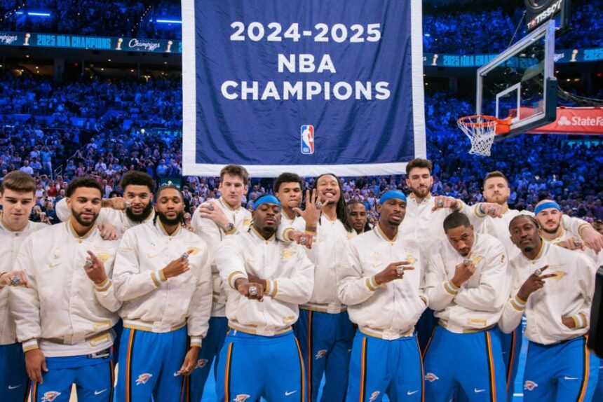 Oklahoma City Thunder players pose with their rings in front of the championship banner prior to the game against the Houston Rockets at Paycom Center.