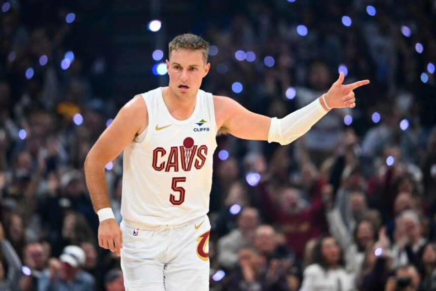Guard Sam Merrill #5 of the Cleveland Cavaliers celebrates during the first quarter against the Milwaukee Bucks at Rocket Arena.