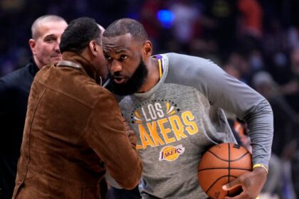 LeBron James #6 of the Los Angeles Lakers greets ESPNs Stephen A. Smith prior to a NBA basketball game against the LA Clippers at the Crypto.com Arena in Los Angeles on Thursday, March 3, 2022.