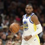 Jonathan Kuminga #00 of the Golden State Warriors handles the ball during the NBA game at PHX Arena.