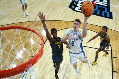 Cooper Flagg #2 of the Duke Blue Devils attempts a shot against VJ Edgecombe #7 of the Baylor Bears in the second round of the NCAA Men's Basketball Tournament at Lenovo Center on March 23, 2025 in Raleigh, North Carolina.