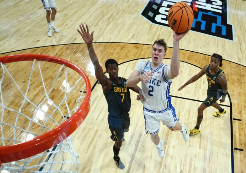 Cooper Flagg #2 of the Duke Blue Devils attempts a shot against VJ Edgecombe #7 of the Baylor Bears in the second round of the NCAA Men's Basketball Tournament at Lenovo Center on March 23, 2025 in Raleigh, North Carolina.