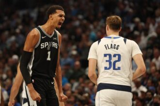Victor Wembanyama #1 of the San Antonio Spurs reacts to a score during the first half against the Dallas Mavericks at American Airlines Center on October 22, 2025 in Dallas, Texas.