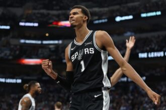 Victor Wembanyama #1 of the San Antonio Spurs reacts to an officials call during the first half against the Dallas Mavericks at American Airlines Center.