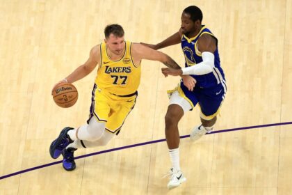 Los Angeles Lakers star Luka Doncic drives against the Golden State Warriors' Jonathan Kuminga.