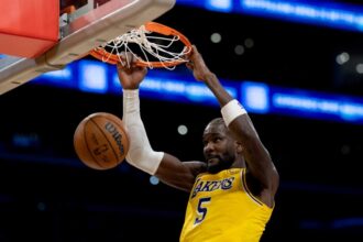 Los Angeles Lakers center Deandre Ayton (5) dunks during the second half of an NBA basketball game against the Minnesota Timberwolves at Crypto.com Arena on Friday, Oct. 24, 2025 in Los Angeles, CA.