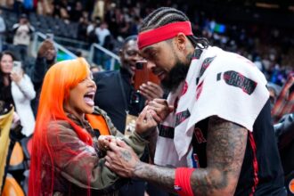 Brandon Ingram #3 of the Toronto Raptors greets rapper GloRilla after hitting the game winning shot against the Indiana Pacers in their basketball game at the Scotiabank Arena.
