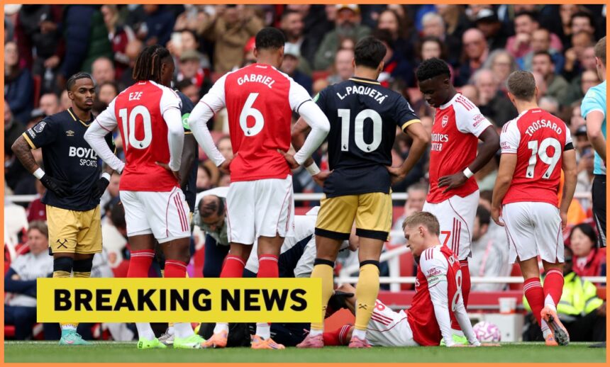 Martin Odegaard nurses an injury during Arsenal vs West Ham